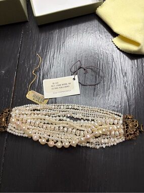 Multi strand natural and cultured pearl bracelet